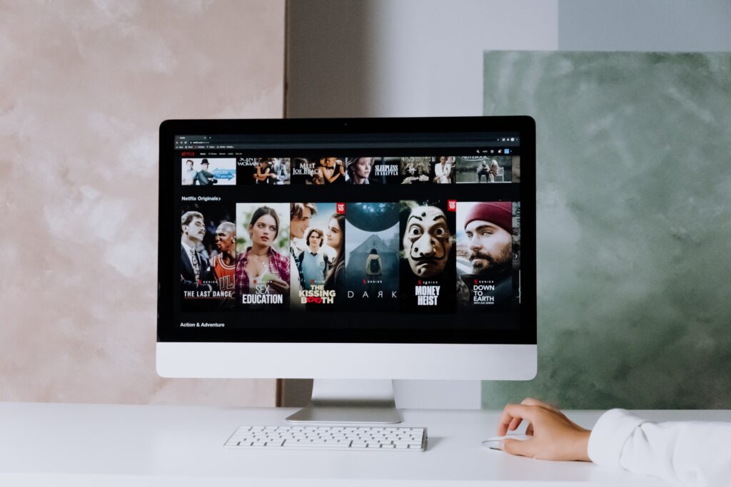 A computer that shows Netflix's home screen and some of its shows. Photo by cottonbro studio: https://www.pexels.com/photo/netflix-on-an-imac-5082566/